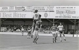 Forest keeper punches the ball off Mick Harfords nose