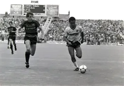 Brian Stein takes on defender in the box