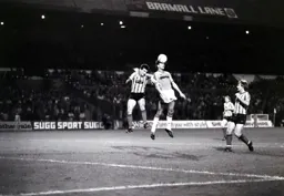 Mick Harford gets his head to a cross