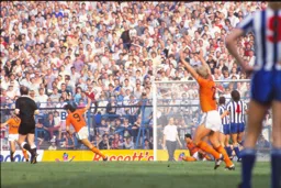 Mick Harford wheels away after scoring Town`s first goal