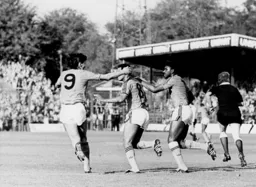 Brian Stein is congratulated on his goal by Mick Harford and Ricky Hill