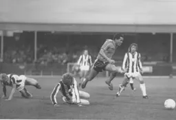 Brian Stein leaves two Albion defenders on the floor