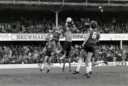 Mick Harford challenges Peter Shilton