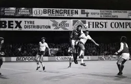 Andy King challenged by Martin Keown