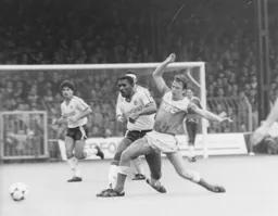 Ricky Hill in a midfield tussle