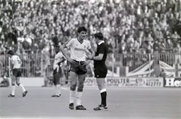 Mick Harford gets a ticking off from the ref