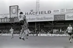 Mick Harford rises to the ball