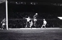 United keeper Chris Turner cuts out a cross with Brian Stein the intended target