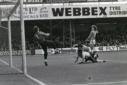Mick Harford heads over