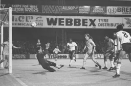 No goal this time as Ricky Hill, Steve Foster and Mike Newell attack the Albion goal
