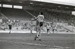 Mick Harford well above the defender