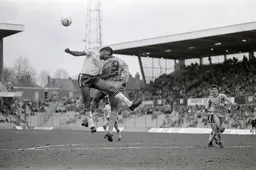 Ricky Hill goes for the header