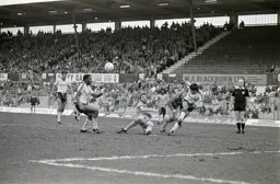 Mike Newell cannot direct the ball towards goal