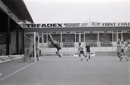 Brian Stein watches as United keeper tips the ball over bar