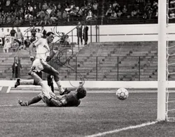 Brian Stein slots the ball past former Town loanee Tony Godden for Town`s third goal