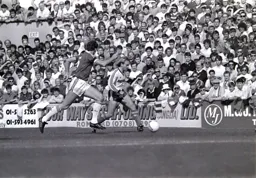 David Preece makes a forward run pursued by Alvin Martin