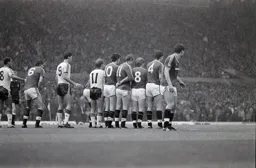 United form a defensive wall as the Town prepare to take a free kick
