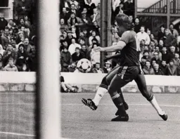 On its way. Ricky Hill`s shot beats Jan Molby and Town go 3-0 up