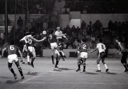 Mal Donaghy gets in front of former Hatter Mark Aizlewood to direct a header towards the goal