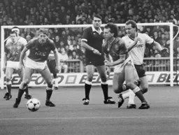 Midfield action involving Peter Nicholas and future Hatter Alan Harper