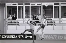 Stacey North heads the ball clear from John Barnes