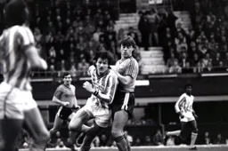 Mal Donaghy and Micky Gynn search for the ball