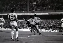 Brian Stein and Mick Harford make their way back to the half way line after Harford`s goal