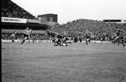 Brian Stein goes to ground after a tackle on the edge of the penalty area