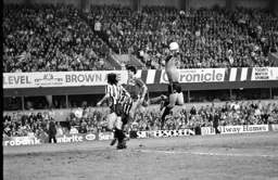 United keeper Martin Thomas makes sure the ball does not reach Mick Harford
