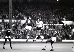 Martin Keown heads the ball away from Mal Donaghy