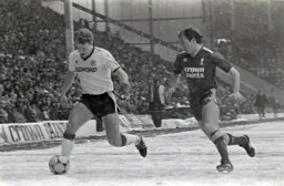Tim Breacker goes past Steve McMahon