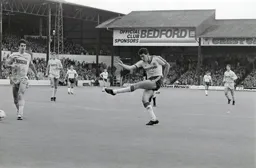 Mike Newell hammers in the Town`s second goal. Gary Stevens can only watch