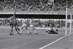 Mark Stein turns away after scoring the Town`s first goal. Ricky Hill raises his arm in triumph