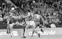 Mick Harford beats Peter Shirtliff in the air