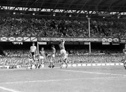Neville Southall cuts out a cross aimed at Mike Newell