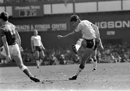 Mike Newell goes for a shot from distance