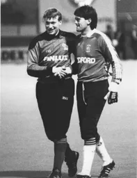 Goalkeepers Pressman and Sealey exchanage pleasantries after Sealey suffers an injury that will keep him out of the League Cup Final