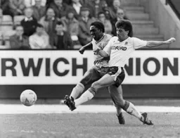Rob Johnson in a clash with Canaries Ruel Fox