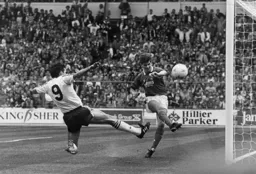 Brian Laws clears off the line despite Mick Harford closing in on goal