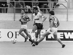Mick Harford plays the ball forward