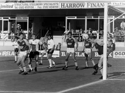 Town are frustrated again as Lars Elstrup watches as Bernard Gallacher heads off the line.