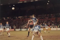 John Dreyer heads the ball clear