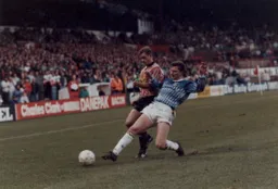 Dave Beaumont goes in with a sliding tackle