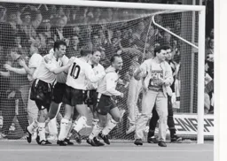 Town players and a spectator celebrate after Lars Elstrup has just scored the second goal