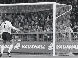 Lars Elstrup watches as Derby`s Mick Harford`s own goal nestles in the net
