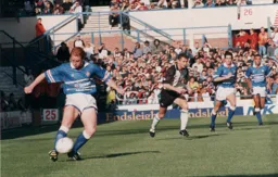 John Hartson with maximum effort in the autumn sun