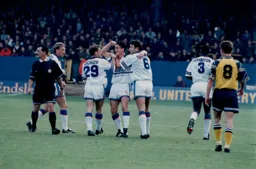 Paul Dickov and John Dreyer celebrate with Ceri Hughes