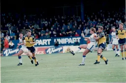Kerry Dixon passes the ball forward