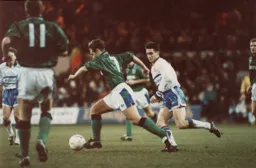 Ceri Hughes moves in challenge John Morrissey