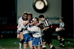 John Hartson is congratulated by Jamie Campbell and David Preece